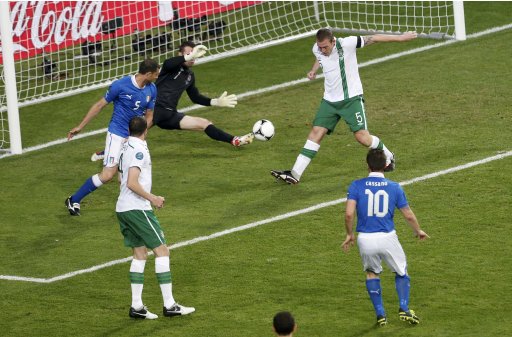 Italy's Cassano tries to score as Ireland's Dunne saves in front of goalkeeper Given during their Group C Euro 2012 soccer match at the City stadium in Poznan