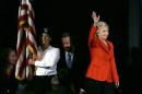 Democratic presidential candidate Hillary Rodham Clinton waves to supporters as she walks on stage during the Iowa Democratic Party's Hall of Fame Dinner, Friday, July 17, 2015, in Cedar Rapids, Iowa. (AP Photo/Charlie Neibergall)