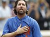 FILE - This Sept. 27, 2012 file photo shows New York Mets starting pitcher R.A. Dickey reacting to fans as he celebrates his 20th victory of the season after the Mets 6-5 win against the Pittsburgh Pirates in a baseball game at Citi Field in New York. A person familiar with the deal tells The Associated Press that Dickey and the Blue Jays have agreed on a new contract, clearing the way for the New York Mets to trade the Cy Young winner to Toronto. The person spoke on condition of anonymity Monday, Dec. 17, 2012,  because the trade was not yet complete. The 38-year-old knuckleballer must pass a physical before he joins the Blue Jays. The Mets would get prized catching prospect Travis d'Arnaud as the centerpiece of the multiplayer swap. (AP Photo/Kathy Willens, File)