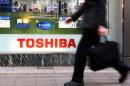 Toshiba shares traded 10.4 percent lower at 397.10 yen in morning trading, paring an earlier loss of as much as 16.3 percent