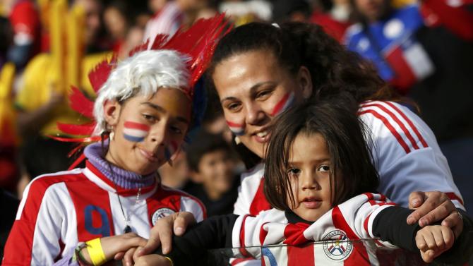 Paraguay fans await the start of the team&#39;s Copa America 2015 quarter-finals soccer match against Brazil at Estadio Municipal Alcaldesa Ester Roa Rebolledo in Concepcion