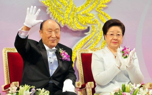 Sun Myung Moon (L), 92, was admitted to a hospital on Tuesday and has been unconscious since then