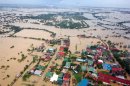 This photo released by the Department of National Defense Wednesday, Aug. 8, 2012, shows flooded areas in Bulacan province, northern Philippines. Widespread flooding battered a million others and paralyzed the Philippine capital began to ease Wednesday as cleanup and rescue efforts focused on a large number of distressed residents, some still marooned on their roofs. (AP Photo/Department of National Defense)