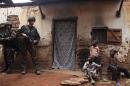 French soldiers patrol in a neighbourhood during a daytime patrol as shooting continued overnight the capital Bangui