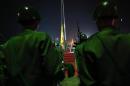 Guards of honour stand at attention during a flag-raising ceremony to mark Myanmar's 66th Independence Day at the People's Square near Shwedagon pagoda in Yangon