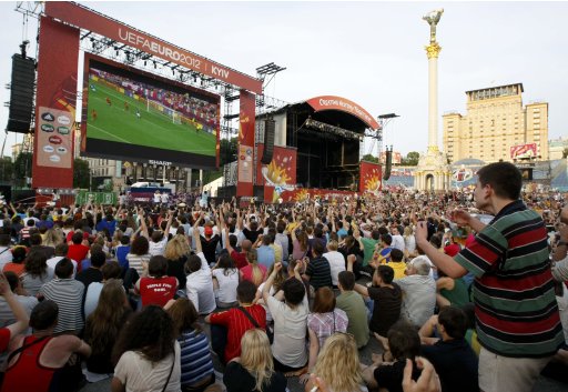 Soccer fans react as they watch Euro 2012 soccer match between Spain and Italy in the fan zone in Kiev