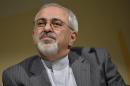 Iranian Foreign Minister Mohammad Javad Zarif briefs the media after the two days of closed-door nuclear talks, during a press conference at the CICG, in Geneva, Switzerland, Wednesday, Oct.16, 2013. (AP Photo/Keystone, Martial Trezzini)