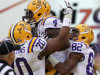 LSU running back Alfred Blue (4) celebrate his touchdown with guard La'el Collins (70) and wide receiver James Wright (82) during the first half of an NCAA college football game against Washington in Baton Rouge, La., Saturday, Sept. 8, 2012. (AP Photo/Gerald Herbert)