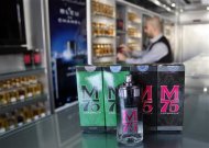 A vendor displays perfume bottles called M75 at his shop in Gaza City December 12, 2012. The Gaza vendor said the new perfume symbolises the name of the home-made M75 rocket. REUTERS/Ahmed Zakot