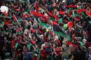 People wave Libyan flags during celebrations commemorating the second anniversary of the country's February 17 revolution, at Martyrs' Square in Tripoli