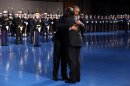 U.S. President Barack Obama hugs Defense Secretary Leon Panetta during the Armed Forces Farewell Tribute to Panetta at Joint Base Myer-Henderson in Washington