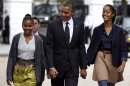President Barack Obama walks to St. John's Episcopal Church from the White House with his daughters Sasha, left, and Malia, in Washington, on Sunday, Oct. 28, 2012. (AP Photo/Jacquelyn Martin)