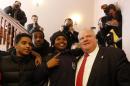 Toronto Mayor Ford poses for a photo with high school students during a break at a meeting of Canadian mayors in Ottawa February