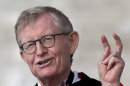 This photo made Sunday, May 5, 2013, shows Ohio State president E. Gordon Gee gesturing as he speaks during the Ohio State University spring commencement in Columbus, Ohio. Gee told a university committee last December that Notre Dame wasn't invited to join the Big Ten because they're not good partners while also jokingly saying that 