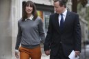 Prime Minister David Cameron and his wife Samantha arrive at the polling station at Methodist Central Hall in Westminster, London, to vote in the mayoral and council elections Thursday May 3, 2012. Opinion polls indicate that London's outspoken, but well-liked, Conservative mayor Boris Johnson seems on course to retain City Hall in British elections. (AP Photo / Peter Macdiarmid)