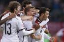 Germany's Max Kruse, center, celebrates after scoring his side's second goal during the Euro 2016 group D qualifying soccer match between Germany and Georgia in Leipzig, Germany, Sunday, Oct. 11, 2015. (AP Photo/Michael Sohn)
