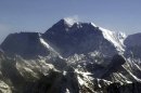 FILE - In this Tuesday, May 6, 2003 file photo, Mount Everest, at 8,850-meter (29,035-foot), the world's tallest mountain situated in the Nepal-Tibet border as seen from an airplane. Days after four people died amid a "traffic jam" of climbers scrambling to conquer Mount Everest, Nepal officials said a similar rush up the world's tallest peak will begin soon, and there's little they can do to control it. (AP Photo/Binod Joshi, File)