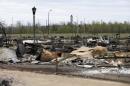 Charred vehicles are pictured in the Beacon Hill neighbourhood of Fort McMurray