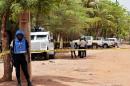 UN peacekeeping solders stand by a cordon set up at the site where a gunman opened fire at a UN residence in Bamako, on May 20, 2015