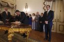 Portugal's PM Passos Coelho and President Silva attend the swearing-in ceremony of new ministers at the Belem palace in Lisbon