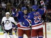 Pittsburgh Penguins' Douglas Murray (3) reacts as New York Rangers' Brian Boyle, center, hugs Ryane Clowe (29) after Clowe scored his second goal of the game during the first period of an NHL hockey game, Wednesday, April 3, 2013, in New York. (AP Photo/Frank Franklin II)