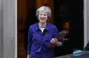 British Prime Minister Theresa May (L) emphasised to president-elect Donald Trump her wish to strengthen trade and investment with the US