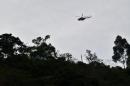 An army helicopter flies over El Mango in the department of Cauca, Colombia, on June 27, 2015