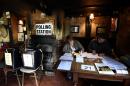 Election officials work at a table inside the White Horse Inn, which is being used as a polling station in Priors Dean, southern England Thursday May 7, 2015. Polls have opened in Britain's national election, a contest that is expected to produce an ambiguous result, a period of frantic political horse-trading and a bout of national soul-searching. (Andrew Matthews/PA via AP) UNITED KINGDOM OUT