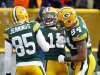 Green Bay Packers' Randall Cobb (18) celebrates with Greg Jennings and D.J. Williams after Cobb caught a touchdown pass during the first half of an NFL football game Sunday, Dec. 23, 2012, in Green Bay, Wis. (AP Photo/Mike Roemer)