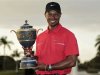 Woods poses with the Gene Sarazen Trophy after winning the 2013 WGC-Cadillac Championship PGA golf tournament in Doral
