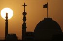 India's presidential palace Rashtrapati Bhavan is silhouetted against the setting sun in New Delhi
