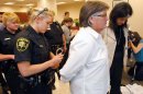 Forsyth County sheriff's deputies arrest Mary Lee Bradford of Winston-Salem and Mary Jamis of Mocksville after they refused to leave at the Forsyth County Register of Deeds office in Winston-Salem, N.C., Thursday, May 10, 2012. The two women staged a sit in at the office after some couples were refused a marriage license because they were gay or lesbian. (AP Photo/Bob Leverone)