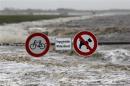 Traffic signs are seen on the North Sea beach near the town of Norddeich