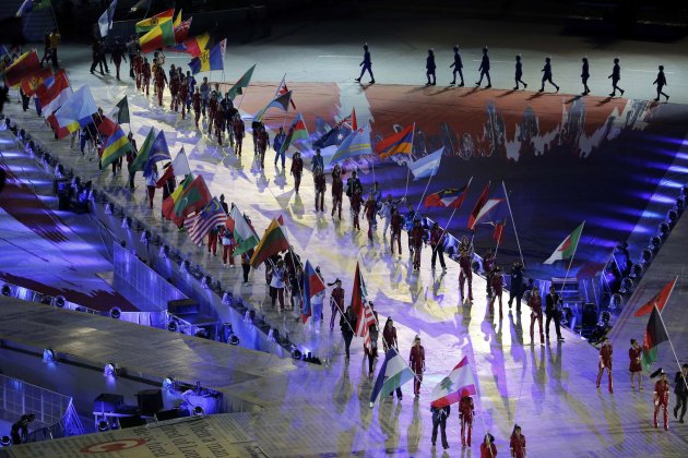 Athletes carry national flags during the closing ceremony of the London 2012 Olympic Games