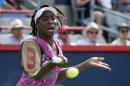 Venus Williams of the United States returns a ball during second round of play at the Rogers Cup tennis tournament Wednesday July 27, 2016, in Montreal. (Paul Chiasson/The Canadian Press via AP)