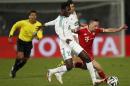 Kouko Guehi of Morocco's Raja Casablanca fights for the ball with Franck Ribery of Germany's Bayern Munich during their 2013 FIFA Club World Cup final soccer match at Marrakech stadium