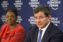 Turkish Foreign Minister Ahmet Davutoglu, center, speaks to the media as United Nation Under-Secretary-General for Humanitarian Affairs and Emergency Relief Coordinator, British Valerie Amos, left, sits next to him during a press conference on Syria at the 43rd Annual Meeting of the World Economic Forum, WEF, in Davos, Switzerland, Wednesday, Jan. 23, 2013. (AP Photo/Michel Euler)