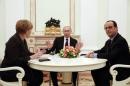 German Chancellor Merkel, Russia's President Putin and French President Hollande attend a meeting on resolving the Ukraine crisis at the Kremlin in Moscow