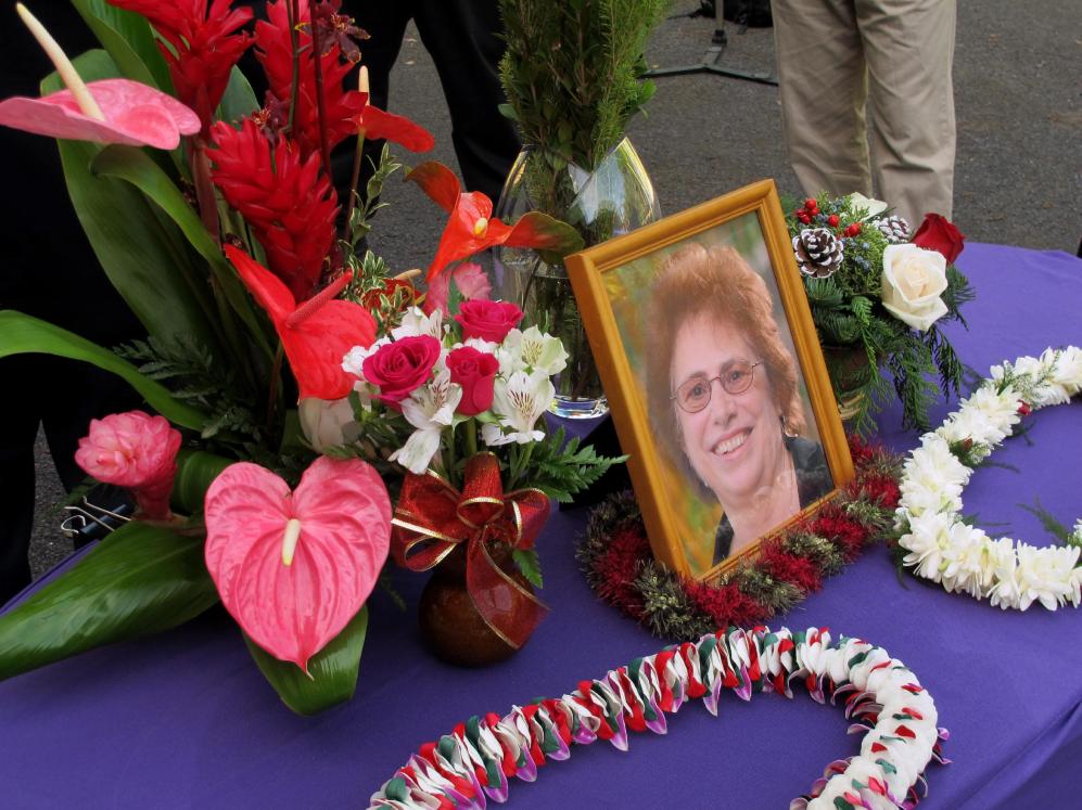 A memorial for Loretta Fuddy, the director of the state Department of Health, is displayed outside the department in Honolulu on Thursday, Dec. 12, 2013. Fuddy died in a plane crash off Molokai on Wednesday. (AP Photo/Audrey McAvoy)