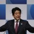 Japan's Prime Minister Shinzo Abe delivers a speech to business leaders and scholars during a meeting hosted by Japan Akademeia in Tokyo