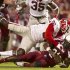 South Carolina running back Marcus Lattimore is tackled by Georgia strong safety Shawn Williams during the first quarter of an NCAA college football game in Columbia, S.C., Saturday, Oct. 6, 2012. (AP Photo/Brett Flashnick)