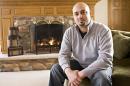 This photo taken in 2011 shows Abe Mashal posing for a photo at his home in St. Charles, Ill. The Obama administration is promising to change the way travelers can ask to be removed from its no-fly list of suspected terrorists banned from air travel. One of the plaintiffs in the Portland lawsuit, Abe Mashal, was unable to print his boarding pass before a flight out of Chicago four years ago. A counter representative told him he was on the no-fly list and would not be allowed to board. Mashal was surrounded by about 30 law enforcement officials, he said. (AP Photo/Sun-Times Media) MANDATORY CREDIT, MAGS OUT,