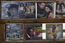 A DVD production called Obama in Cuba is displayed for sale alongside pirated CDs in Havana