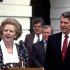 FILE - In a Friday, July 17, 1987 file photo, Prime Minister Margaret Thatcher of the United Kingdom, left, makes remarks after visiting United States President Ronald Reagan, right, at the White House in Washington, D.C. Thatchers former spokesman, Tim Bell, said that the former British Prime Minister Margaret Thatcher died Monday morning, April 8, 2013, of a stroke. She was 87. (AP Photo/DPA, Howard L. Sachs, File)