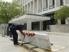 A United State Capitol Police officer secures a vehicle barrier outside of the Hart Senate Office Building in Washington