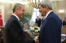 In this photo released by the Turkish Presidency Press Office, Turkish President Recep Tayyip Erdogan, left, and U.S. Secretary of State John Kerry speak before a meeting in Ankara, Turkey, Friday, Sept. 12, 2014. Kerry is in the region to speak with leaders about strategies to address the threat from the Islamic State, a militant extremist group. Secretary of State John Kerry said on Friday that the US would provide an additional $500 million in humanitarian aid to victims of the war in Syria, bringing total American assistance to $2.9 billion since the start of the conflict in 2011. (AP Photo/Turkish Presidency)