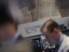 A Goldman Sachs sign is seen over the company's trading stall on the floor at the New York Stock Exchange