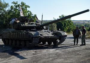 Pro-Russian fighters stand by a T-64 tank in Starobesheve,&nbsp;&hellip;