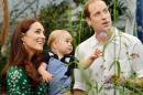 A picture taken on Wednesday July 2, 2014 shows Prince William (R) and Catherine, Duchess of Cambridge (L) with Prince George during a visit to the Sensational Butterflies exhibition at the Natural History Museum in London