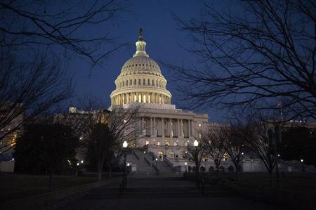Darkness sets in over the U.S. Capitol building hours before U.S. President Barack Obama is set to deliver his State of the Union address to a joint session of Congress on Capitol Hill in Washington January 24, 2012. REUTERS/Jonathan Ernst